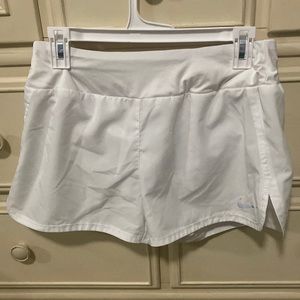 White Nike running shorts